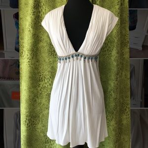 White, V-neck, empire waist mini dress with rhinestone embellishments